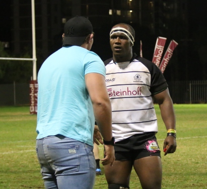 An intense conversation between Masakhane member, Junior Mnisi and the assisting coach.